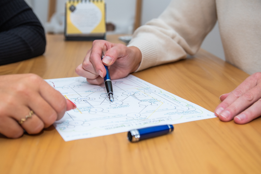 A spiritual still life with tarot cards, herbs, and crystals on a dark surface for meditation.